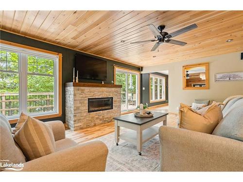 1201 Tingey Road N, Bracebridge, ON - Indoor Photo Showing Living Room With Fireplace