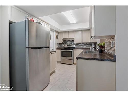 A405-216 Plains Road W, Burlington, ON - Indoor Photo Showing Kitchen With Double Sink