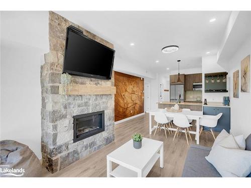 205-18 Beckwith Lane, The Blue Mountains, ON - Indoor Photo Showing Living Room With Fireplace