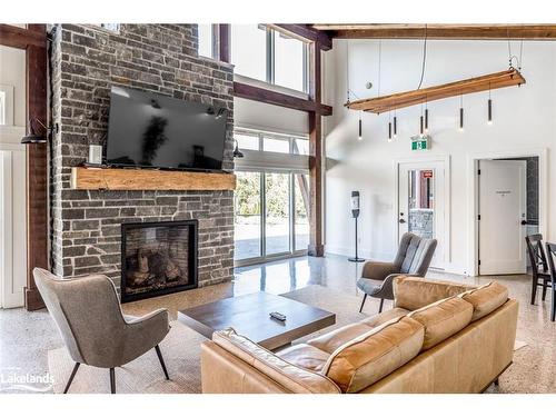 205-18 Beckwith Lane, The Blue Mountains, ON - Indoor Photo Showing Living Room With Fireplace