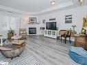 208-130 Steamship Bay Road, Gravenhurst, ON  - Indoor Photo Showing Living Room With Fireplace 