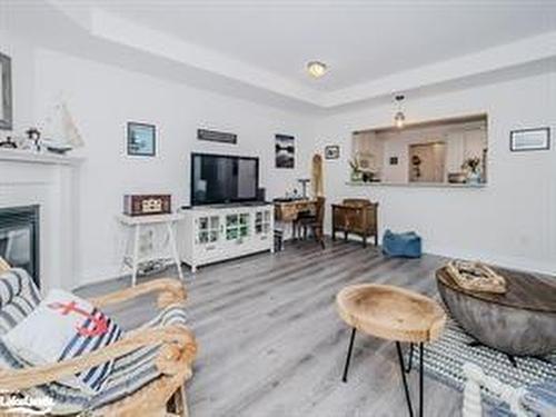 208-130 Steamship Bay Road, Gravenhurst, ON - Indoor Photo Showing Living Room With Fireplace