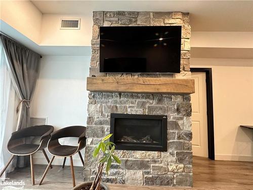 106-12 Beckwith Lane, The Blue Mountains, ON - Indoor Photo Showing Living Room With Fireplace