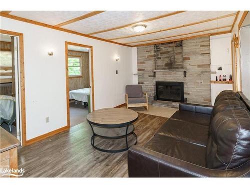 12 Sunset Ridge, Huntsville, ON - Indoor Photo Showing Living Room With Fireplace