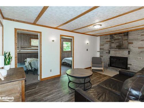 12 Sunset Ridge, Huntsville, ON - Indoor Photo Showing Living Room With Fireplace