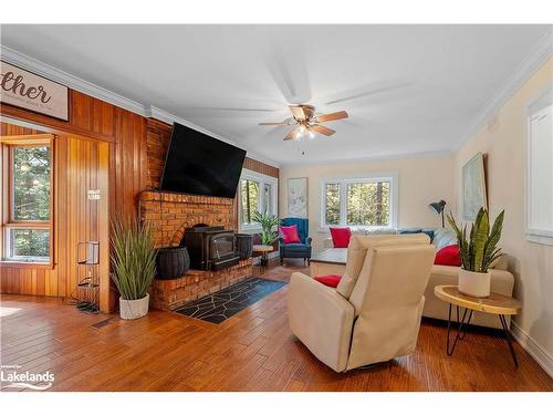 1006 Spring Lake Road, Dwight, ON - Indoor Photo Showing Living Room With Fireplace