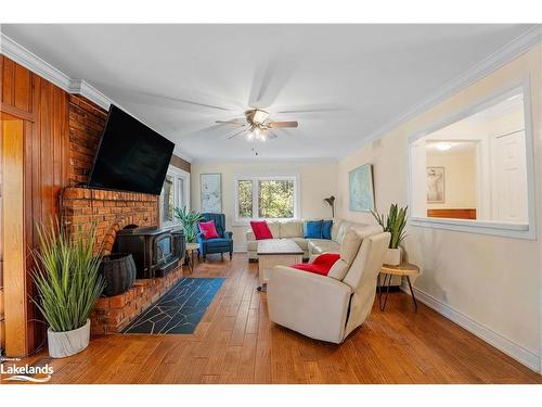 1006 Spring Lake Road, Dwight, ON - Indoor Photo Showing Living Room With Fireplace