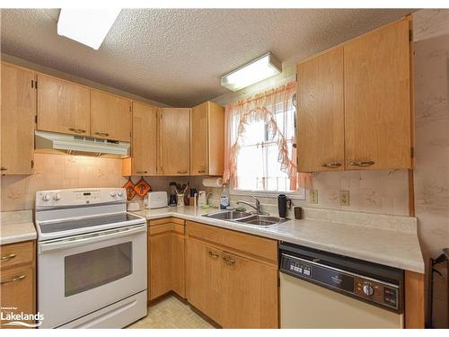 56 Tecumseth Pines Drive, New Tecumseth, ON - Indoor Photo Showing Kitchen With Double Sink