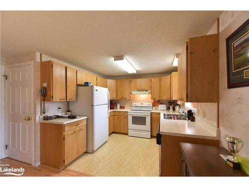 56 Tecumseth Pines Drive, New Tecumseth, ON - Indoor Photo Showing Kitchen With Double Sink