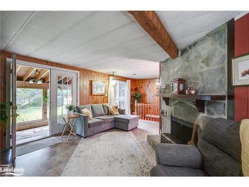 399 Otter Lake Road, Huntsville, ON - Indoor Photo Showing Living Room With Fireplace