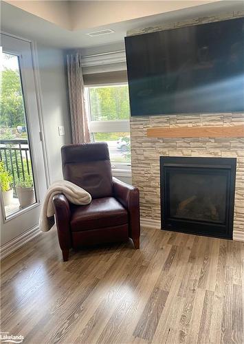 202-2 Anchorage Crescent, Collingwood, ON - Indoor Photo Showing Living Room With Fireplace