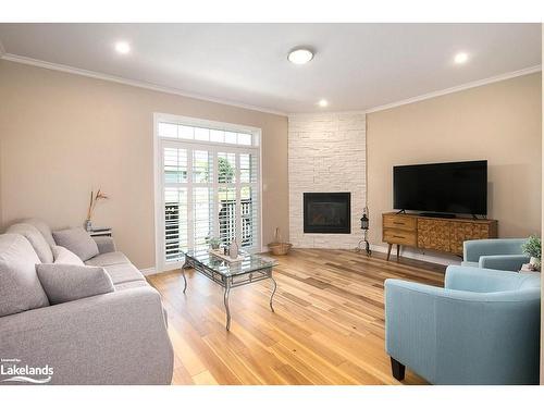 1-24 Albery Court, Meaford, ON - Indoor Photo Showing Living Room With Fireplace