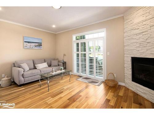 1-24 Albery Court, Meaford, ON - Indoor Photo Showing Living Room With Fireplace