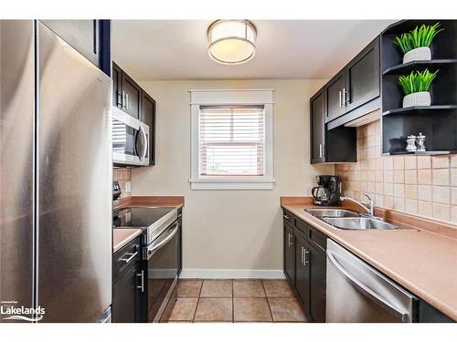 206-115 Fairway Court, The Blue Mountains, ON - Indoor Photo Showing Kitchen With Double Sink