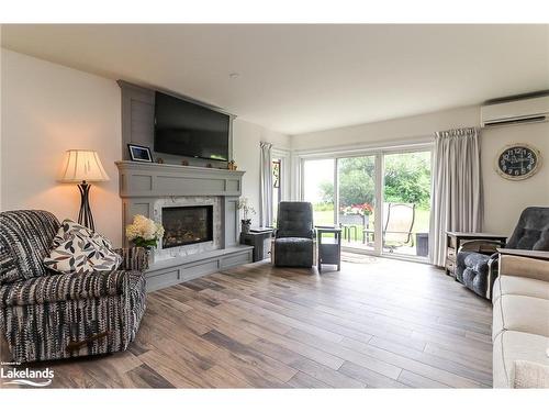 18-44 Trott Boulevard, Collingwood, ON - Indoor Photo Showing Living Room With Fireplace