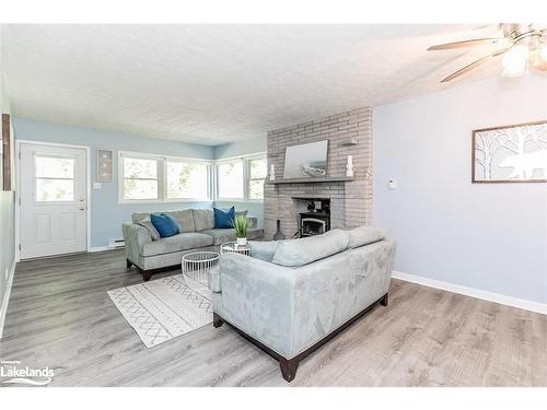 229 Bruce Road 23, Kincardine, ON - Indoor Photo Showing Living Room With Fireplace