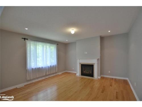 66 White Sands Way, Wasaga Beach, ON - Indoor Photo Showing Living Room With Fireplace