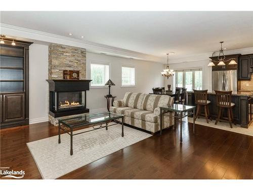 307-130 Steamship Bay Road, Gravenhurst, ON - Indoor Photo Showing Living Room With Fireplace