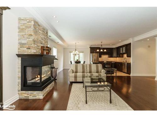 307-130 Steamship Bay Road, Gravenhurst, ON - Indoor Photo Showing Living Room With Fireplace