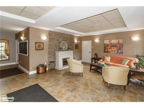 307-130 Steamship Bay Road, Gravenhurst, ON - Indoor With Fireplace