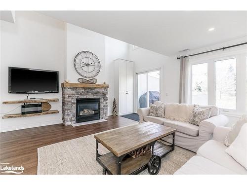 212-110 Fairway Court, The Blue Mountains, ON - Indoor Photo Showing Living Room With Fireplace