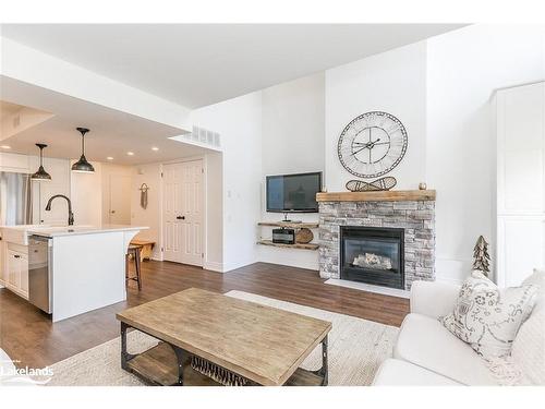 212-110 Fairway Court, The Blue Mountains, ON - Indoor Photo Showing Living Room With Fireplace