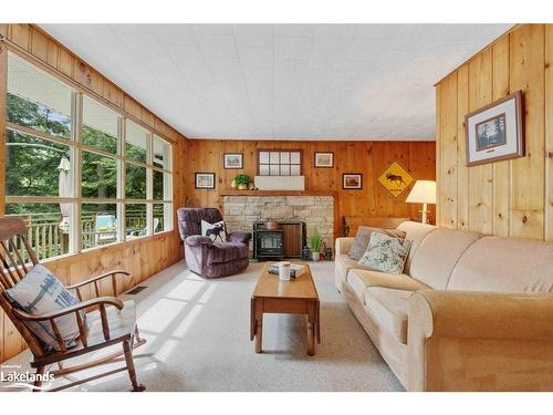 265 Mica Mine Road, Huntsville, ON - Indoor Photo Showing Living Room With Fireplace