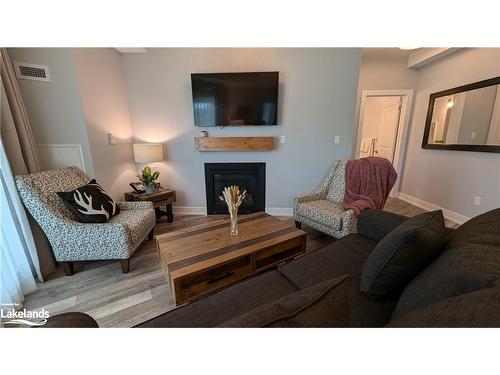 316-25 Pen Lake Point Road, Huntsville, ON - Indoor Photo Showing Living Room With Fireplace