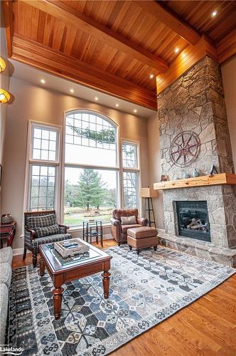 Carling 4, W10-3876 Muskoka Road 118 West, Port Carling, ON - Indoor Photo Showing Living Room With Fireplace