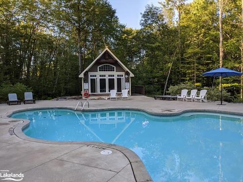 Carling 4, W10-3876 Muskoka Road 118 West, Port Carling, ON - Outdoor With In Ground Pool With Backyard