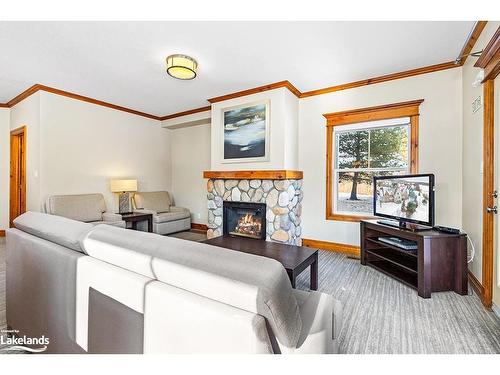 109-184 Snowbridge Way, The Blue Mountains, ON - Indoor Photo Showing Living Room With Fireplace