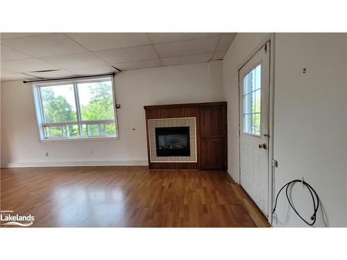 C01-280 River Road E, Wasaga Beach, ON - Indoor Photo Showing Living Room With Fireplace