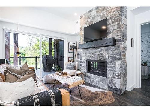 101-18 Beckwith Lane, The Blue Mountains, ON - Indoor Photo Showing Living Room With Fireplace