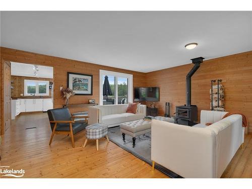 1433 South Horn Lake Road, Ryerson, ON - Indoor Photo Showing Living Room With Fireplace