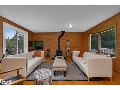 1433 South Horn Lake Road, Ryerson, ON - Indoor Photo Showing Living Room With Fireplace