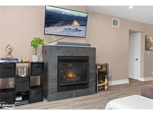 102-4 Tree Tops Lane, Huntsville, ON - Indoor Photo Showing Living Room With Fireplace