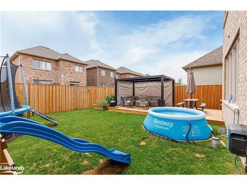 48 Mclean Avenue, Collingwood, ON - Outdoor With Above Ground Pool With Deck Patio Veranda With Backyard