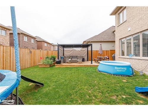 48 Mclean Avenue, Collingwood, ON - Outdoor With Above Ground Pool With Deck Patio Veranda With Backyard With Exterior