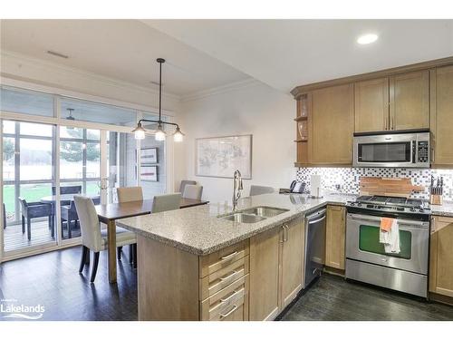 G103- A1-1869 Muskoka 118 Road W, Bracebridge, ON - Indoor Photo Showing Kitchen With Double Sink