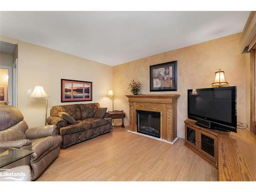 2 Sunset Trail, Whitestone, ON - Indoor Photo Showing Living Room With Fireplace