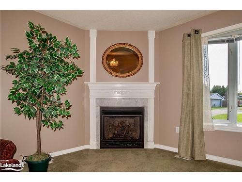 15 Pinecone Drive, Bracebridge, ON - Indoor Photo Showing Living Room With Fireplace