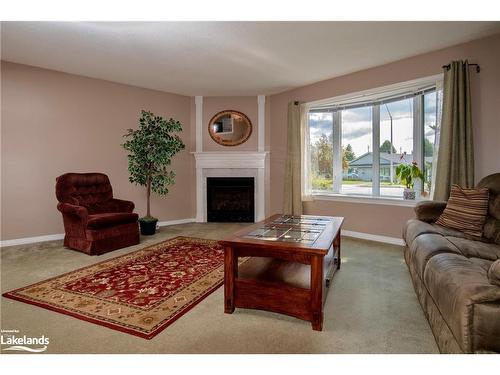 15 Pinecone Drive, Bracebridge, ON - Indoor Photo Showing Living Room With Fireplace