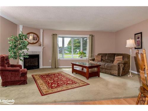 15 Pinecone Drive, Bracebridge, ON - Indoor Photo Showing Living Room With Fireplace