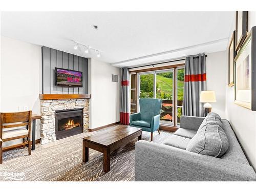 319/321-152 Jozo Weider Boulevard, The Blue Mountains, ON - Indoor Photo Showing Living Room With Fireplace