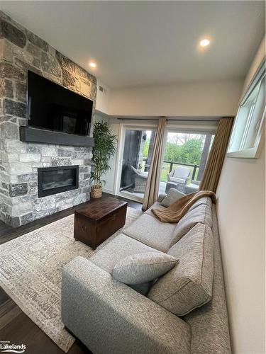 107-12 Beausoleil Lane, The Blue Mountains, ON - Indoor Photo Showing Living Room With Fireplace