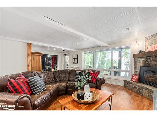 285 Mica Mine Road, Huntsville, ON - Indoor Photo Showing Living Room With Fireplace