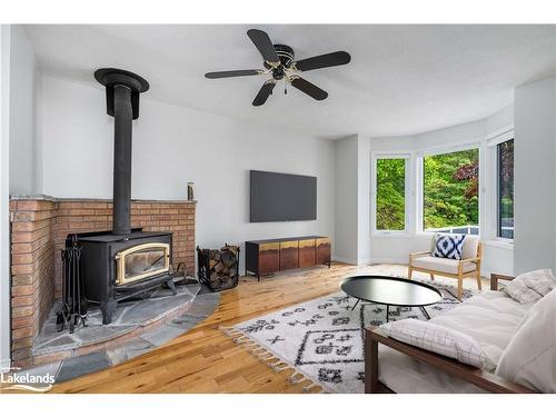 8 Glen Forest Trail, Tiny, ON - Indoor Photo Showing Living Room With Fireplace