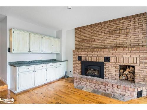 8 Glen Forest Trail, Tiny, ON - Indoor Photo Showing Living Room With Fireplace