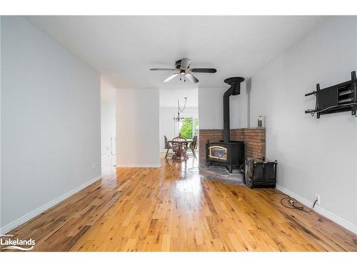 8 Glen Forest Trail, Tiny, ON - Indoor Photo Showing Other Room With Fireplace