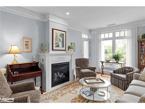 104-140 Cedar Island Road, Orillia, ON - Indoor Photo Showing Living Room With Fireplace